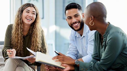 Employees smiling while working