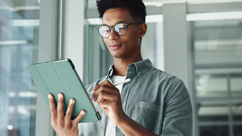 Man looking for a job on his ipad