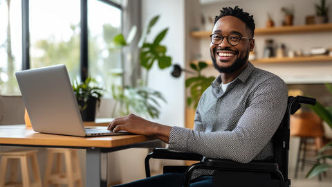 Employee in wheelchair smiling while in training