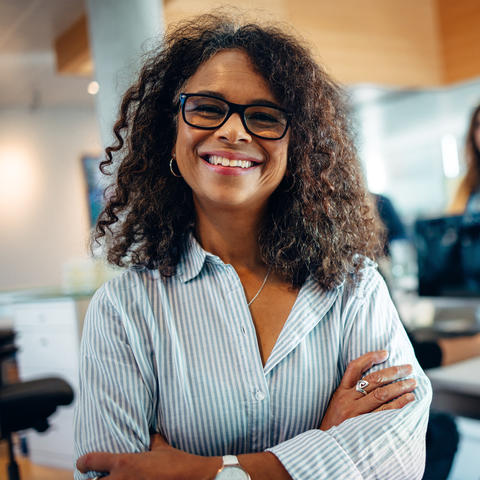 Woman smiling with her arms crossed