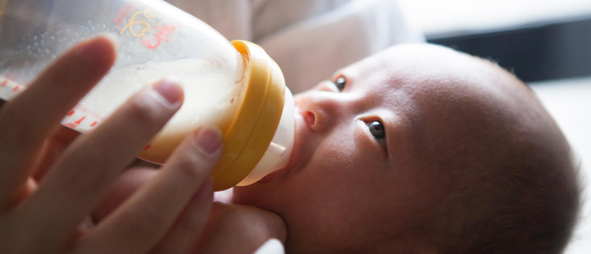 Infant having a bottle