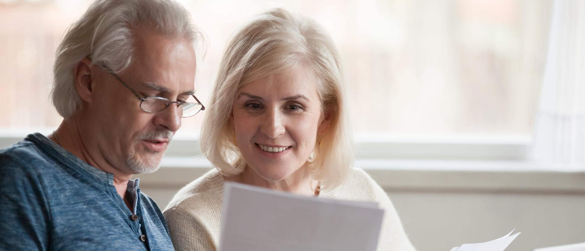 Man and woman looking a documents